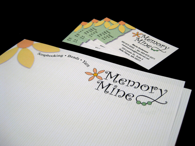 Business card and letterhead with bright yellow flower and curly Memory Mine text.